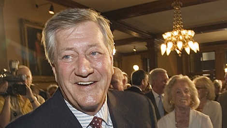Former Ontario Premier Mike Harris smiles at the unveiling ceremony for his official portrait at the Ontario Legislature in Toronto on Tuesday, June 26, 2007. (CP PHOTO/Frank Gunn) 