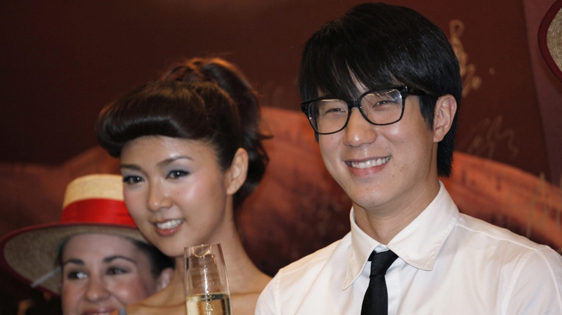 Hong Kong actor Jaycee Chan and actress Fiona Sit react during a premiere of their new film " Break up club " in Hong Kong Monday, June 14, 2010. Jaycee, Jackie Chan's son said he's overcome initial doubts about joining his father in show business, but he prefers making music over movies. Six years after making his debut, 27-year-old Jaycee Chan said he's starting to shed the baggage of his famous family name and finding his niche in the Chinese-language entertainment industry. (AP Photo/Vincent Yu)