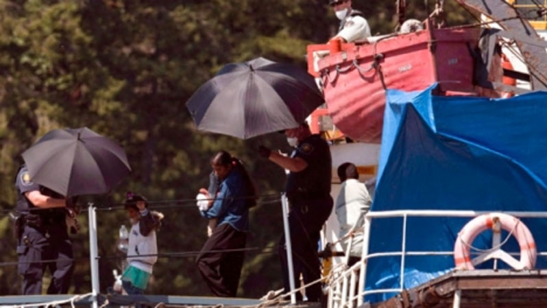 Migrants escorted off MV Sun Sea in Colwood, B.C.