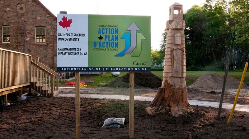 In this photo released by the Liberal party: As the Harper government sells off lighthouses in Atlantic Canada, they've purchased a fake one carved from a tree stump as G8 infrastructure in Rosseau.