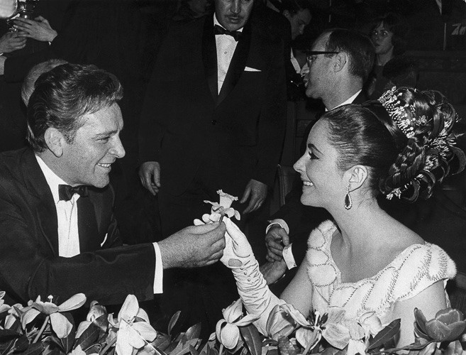 At the premiere of Lawrence of Arabia, starring Richard's friend and Becket co-star, Peter O'Toole, at the Theatre des Champs-Elysees in Paris, June 1963. Their school for scandal did not faze the French, who were quick to celebrate the famous couple. (A.P. Image)