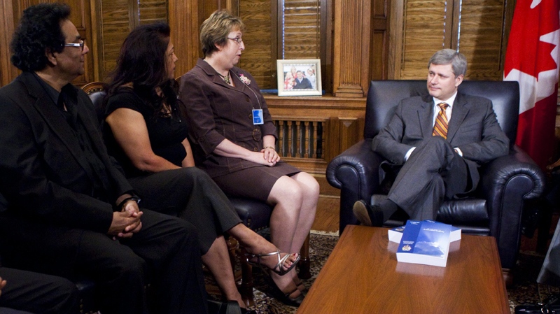 Prime Minister Stephen Harper talks with Malcolm Edwards, left to right, Shipra Rana, and Monique Castonguay, members of the Air India Victims families Association, in his office on Parliament Hill following a press conference delivering the final report on Thursday June 17, 2010, in Ottawa. (Sean Kilpatrick / THE CANADIAN PRESS)  