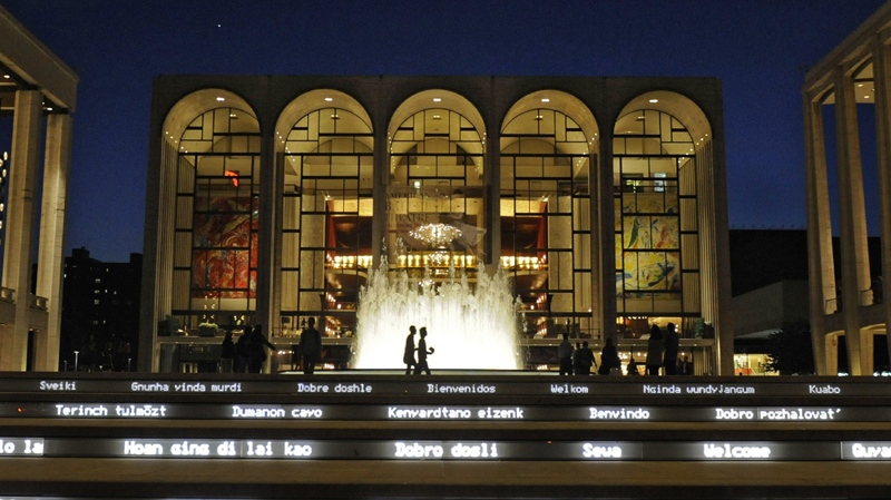 In this file photo of Thursday, May 20, 2010, the Metropolitan Opera House, center, is seen behind a newly rebuilt fountain at Lincoln Center. (AP Photo/Henny Ray Abrams, File)