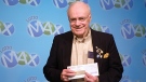 Donald MacDonald holds his $10-million Lotto Max jackpot cheque in this March 2010 handout photo. (THE CANADIAN PRESS/HO-Ontario Lottery and Gaming Corporation)