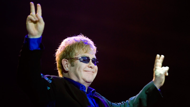 British singer and songwriter Sir Elton John gestures during his concert at the Ramat Gan stadium near Ramat Gan, Israel, Thursday, June 17, 2010. (AP / Ariel Schalit)