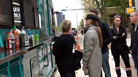 Dozens of Edmontonians participated in a "flash sandwich mob" Friday in support of a food truck being forced to move from a busy downtown corner, on the same day the city granted the truck a one week extension. May 18.