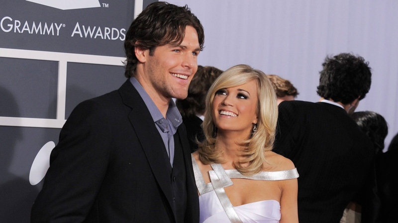 Carrie Underwood and Mike Fisher arrives at the Grammy Awards in Los Angeles, Jan. 31, 2010. (AP / Chris Pizzello) 