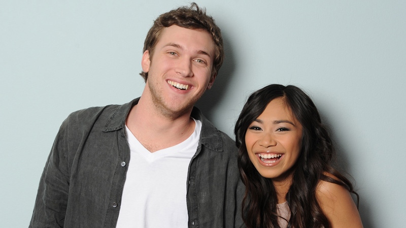 This image provided by FOX-TV shows American Idol finalists Phillip Phillips, left and Jessica Sanchez taken May 17, 2012. (AP Photo/Michael Becker, FOX)