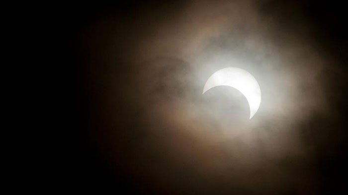 Edmontonians joined millions around the world watching as a rare "ring of fire" eclipse crossed the skies. Photo by: Shayne Bundus. May 21.