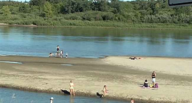 The west bank of the South Saskatchewan River has become a hot spot in hot weather. The sandbar has been used by those wanting to catch a few rays, or play a game of beach volleyball. 