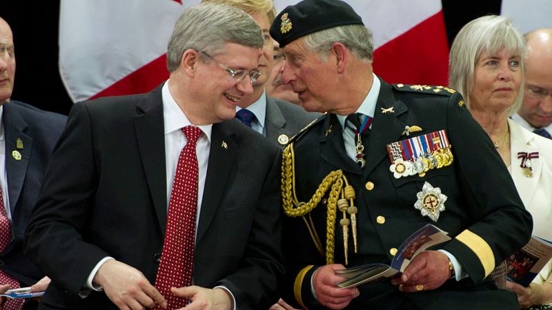 Prince Charles and Prime Minister Stephen Harper chat during the 1812 Commemorative Military Muster in Toronto, on Tuesday, May 22, 2012. (Paul Chiasson / THE CANADIAN PRESS)
