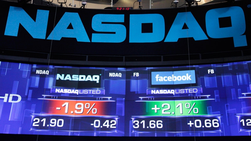 Pre-market prices for Nasdaq stock, left, and Facebook stock are shown at the Nasdaq Market Site in New York