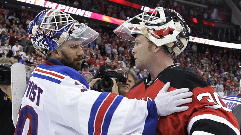 New Jersey Devils goalie Martin Brodeur, right, and New York Rangers goalie Henrik Lundqvist, of Sweden, talk after Game 6 of the NHL hockey Stanley Cup Eastern Conference finals, Friday, May 25, 2012, in Newark, N.J.