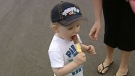 In this image taken from video, Bonnie Wapalk's son enjoys a treat from a B.C. ice cream truck on Friday, May 25, 2012. 