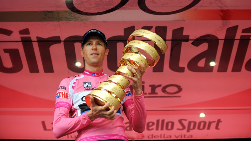 Canada's Ryder Hesjedal holds the trophy after winning the 95th Giro d'Italia, Tour of Italy cycling race, in Milan, Italy, Sunday, May 27, 2012. (AP / Fabio Ferrari)