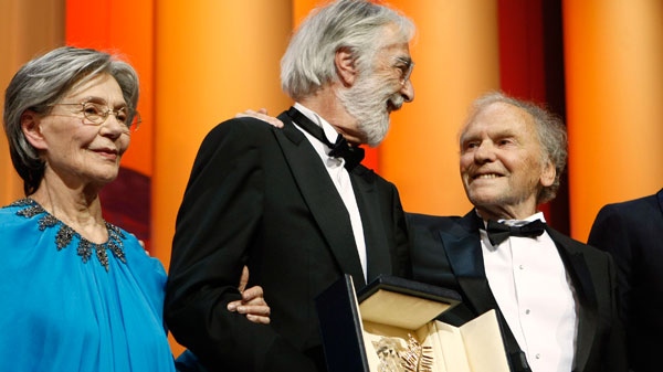 Dirctor Michael Haneke, center, is presented the Palme d'Or award for Amour during the awards ceremony at the 65th international film festival, in Cannes, southern France, Sunday, May 27, 2012. (AP / Lionel Cironneau)