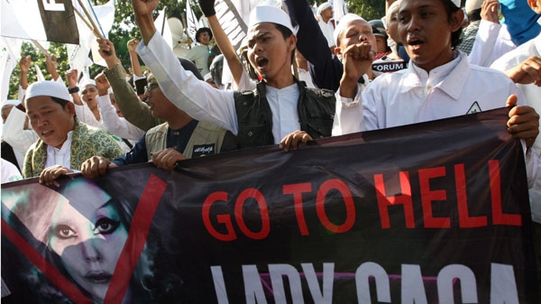 Muslim men shout slogans during a rally against U.S. pop singer Lady Gaga's concert outside the U.S. Embassy in Jakarta, Indonesia, Friday, May 25, 2012. (AP / Dita Alangkara)