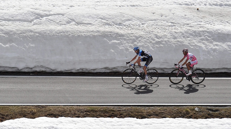 Spain's Joaquin Rodriguez, right, and Canada's Ryder Hesjedal pedal during the 20th stage of the Giro d'Italia, Tour of Italy cycling race, from Caldes to Passo Dello Stelvio, Italy, Saturday, May 26, 2012.