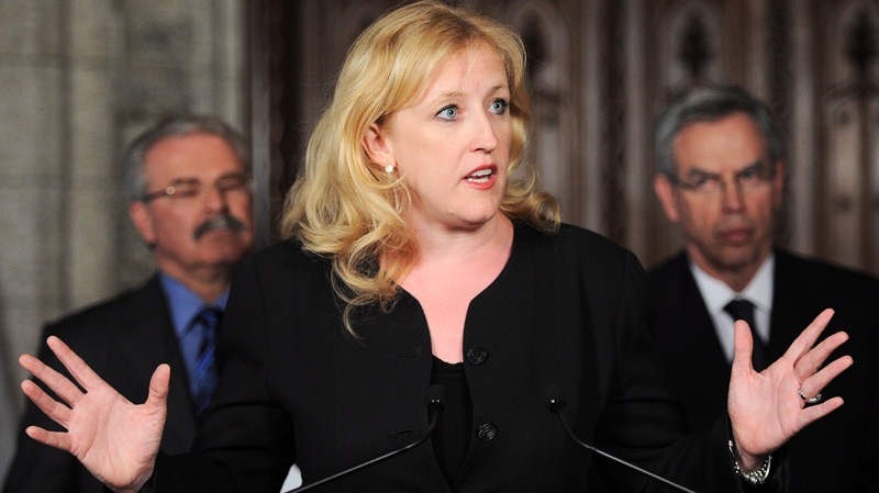 Minister of Labour Lisa Raitt speaks during a press conference in the foyer of the House of Commons on Parliament Hill in Ottawa on Monday, May 28, 2012. (Sean Kilpatrick / THE CANADIAN PRESS)