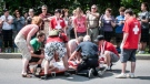 Bystanders jump into action after 25-year-old Chi-Son Do collapses near the finish line at Ottawa Race Weekend