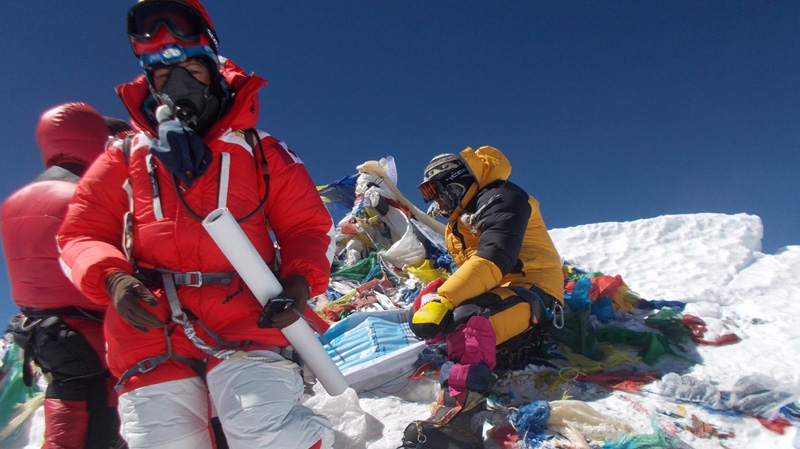 Shriya Shah-Klorfine (foreground), of Toronto, is shown at the summit of Mount Everest. The body of the Canadian woman who died while returning from the summit of Mount Everest is one step closer to being evacuated from the mountain. (Utmost Adventure Trekking Pvt. Ltd.)