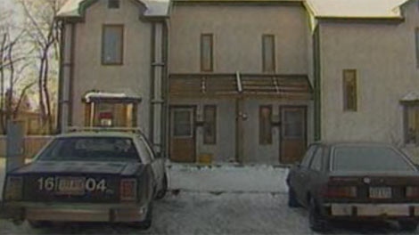 Officers investigate the triple homicide in Winnipeg in 1987. 