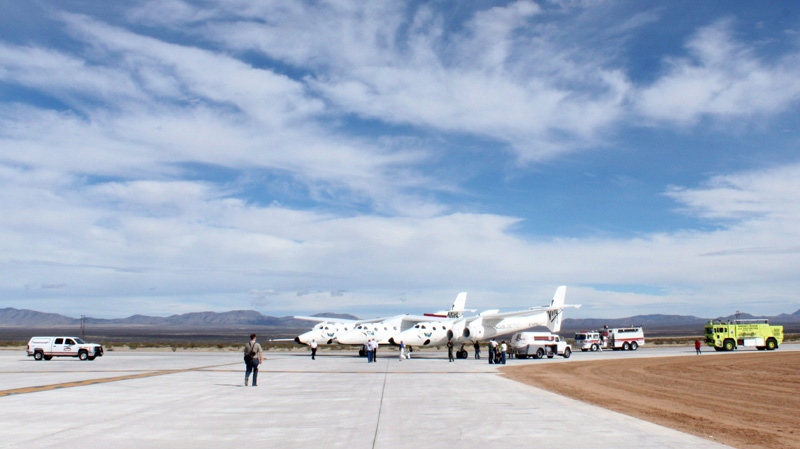 This Oct. 22, 2010, image shows Virgin Galactic's White Knight Two mothership on the runway at Spaceport America in Upham, N.M.  (AP Photo/Susan Montoya Bryan, File)