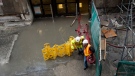 Crews work to contain water after heavy rains caused flooding in the Royal Bank Plaza and Union Station in Toronto on Friday, June 1, 2012. (Aaron Vincent Elkaim / THE CANADIAN PRESS)