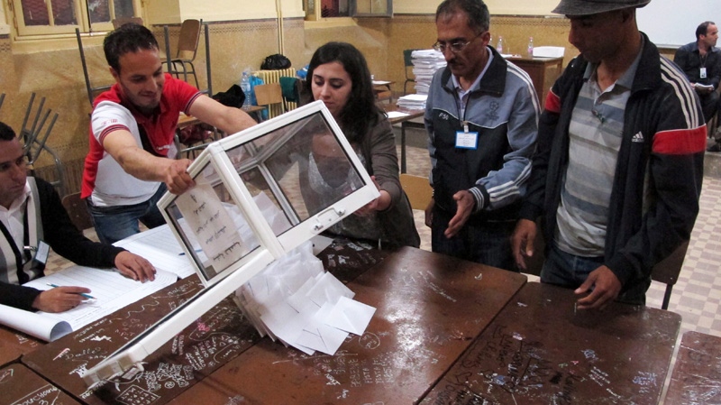 Workers at a polling station empty ballots to begin the counting process, in the Bab el-Oued neighborhood, Algiers, Thursday, May 10, 2012. (AP / Paul Schemm)