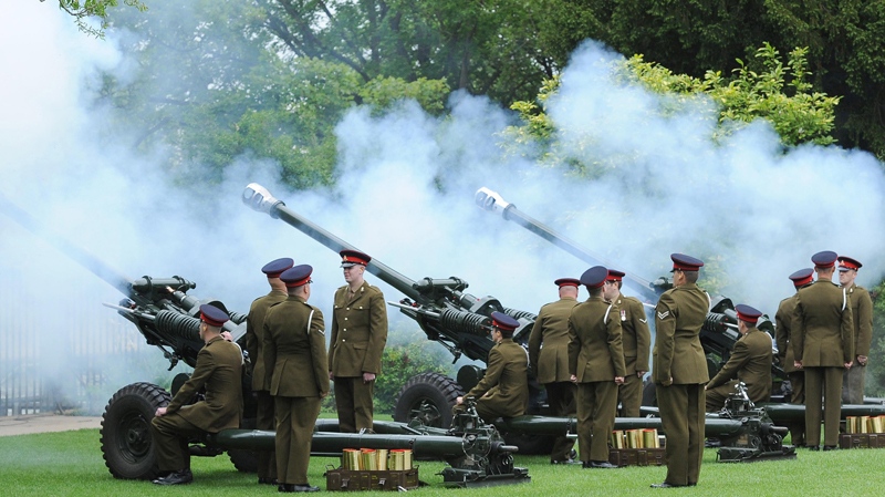 Soldiers from 103rd Regiment Royal Artillery fire a Royal Salute for the Diamond Jubilee celebrations in the Museum Gardens at York, England, Saturday, June 2, 2012. (Anna Gowthorpe / PA)