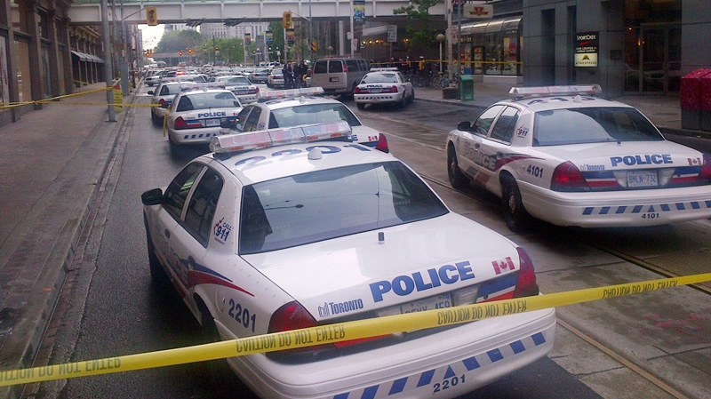 Dozens of police cars set up outside the Eaton Centre shopping mall in Toronto, Saturday, June 2, 2012. (John Chidley-Hill /  THE CANADIAN PRESS)