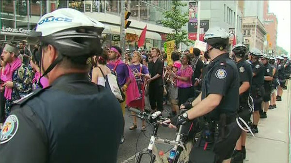 Demonstrators worked eastward on Queen St. W. while police kept a watchful eye on Tuesday, June 22, 2010.