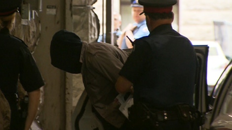 Christopher Husbands, the suspect in the Eaton Centre shooting is seen in police custody, Monday, June 4, 2012. 