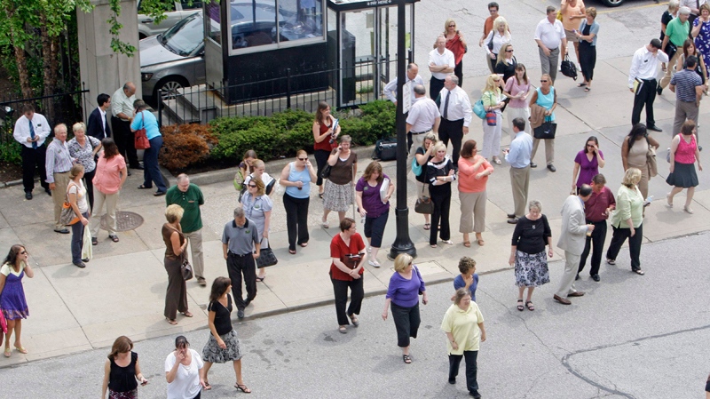 People make their way back to an office building after an earthquake rattled buildings Wednesday, June 23, 2010, in Cleveland. A powerful Canadian earthquake hundreds of miles away rattled Ohio, with the sound of plaster cracking in Cleveland and buildings in Cincinnati gently swaying. There were no immediate reports of any damage in Ohio from Wednesday's 1:41 p.m. quake with a magnitude of 5.5. It struck at the Ontario-Quebec border. (AP / Tony Dejak)