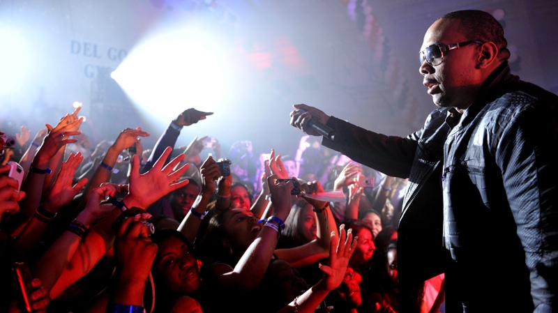 In this photo taken Wednesday, June 23, 2010, Timbaland performs at a graduation party for students at Culver City High School in Culver City, Calif. (AP Photo/Kristian Dowling)