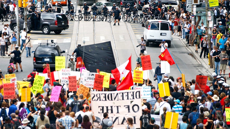 A march for Indigenous rights and against the upcoming G8 and G20 Summits, moves through the streets of Toronto, Thursday, June 24, 2010. (AP / Carolyn Kaster)