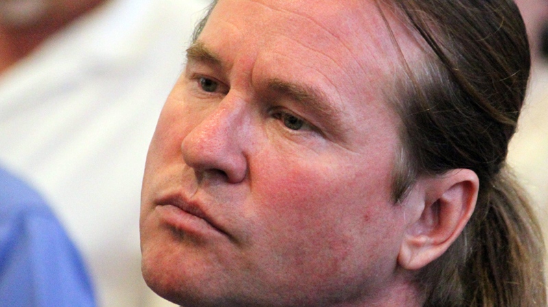 Actor Val Kilmer listens to the San Miguel County Commission during a hearing in Las Vegas, N.M., on Wednesday, June 23, 2010. Kilmer apologized for comments he was quoted as making in two magazine articles years ago. He said his words had been twisted. He said he loves his home in New Mexico and regrets the impact the comments have had. (AP Photo/Susan Montoya Bryan)
