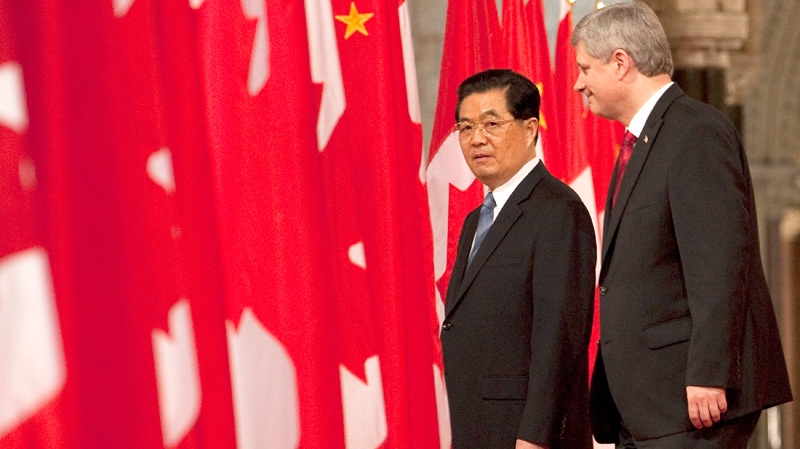 Canadian Prime Minister Stephen Harper walks with Chinese President Hu Jintao through the Hall of Honour on Parliament Hill in Ottawa, Thursday June 24, 2010. (Adrian Wyld / THE CANADIAN PRESS)