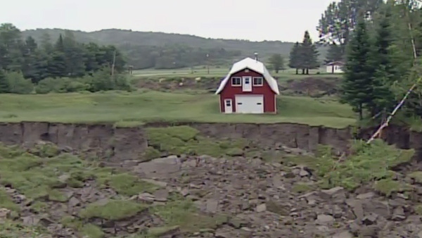 A chasm 50 feet wide and 1,000 feet long opened up on Jeff Carriere's land following a powerful June 23, 2010 magnitude 5.0 earthquake in Quebec.