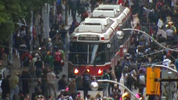 A TTC street car is blocked by a protest on Queen Street West in downtown Toronto, Saturday, June 26, 2010.
