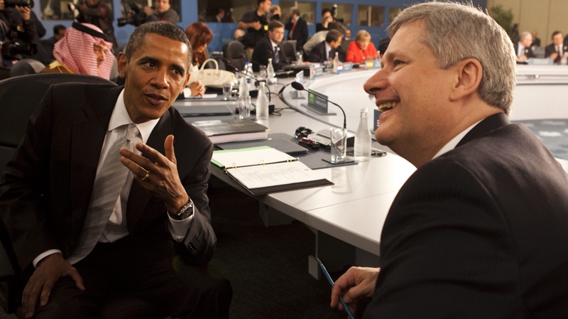 Prime Minister Stephen Harper speaks with U.S. President Barack Obama during a plenary session at the G20 summit in Toronto on Sunday, June 27, 2010. (Sean Kilpatrick / THE CANADIAN PRESS)