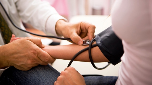 Doctor Checks Blood Pressure 