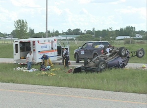 Emergency crews respond to a rollover crash on Highway 11 near Hanley on Tuesday.