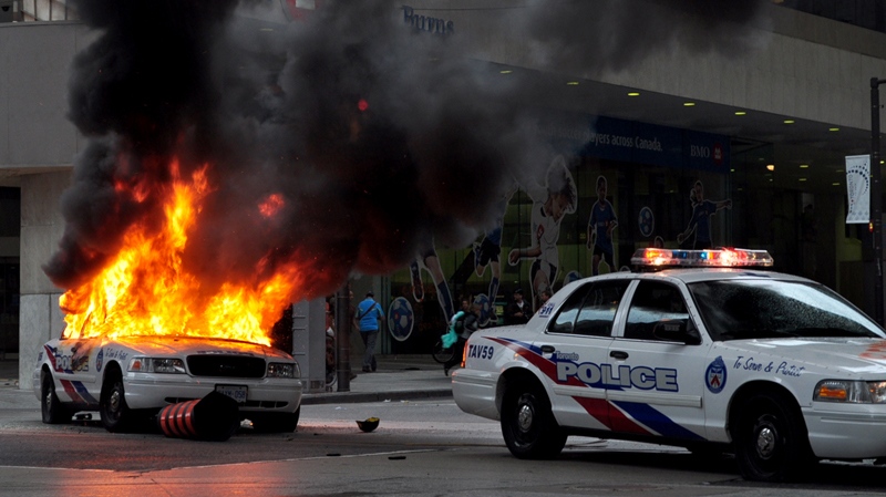 A police car burns after being set on fire by anti G20 protesters in downtown Toronto on Saturday, June 26, 2010. (Asad Munir / MyNews.CTV.ca)   