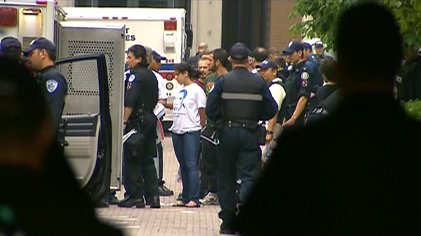 Police move in and make arrests during a massive morning raid near Spadina and College in downtown Toronto, Sunday, June 27, 2010.