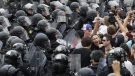 Riot police push against a crowd during a street demonstration on the closing day of the G20 Summit in Toronto, Sunday, June 27, 2010. (AP / Carolyn Kaster)
