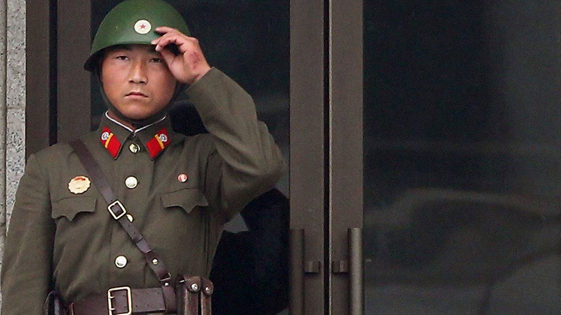 A North Korean soldier looks at the southern side at the border village of Panmunjom, in South Korea, June 30, 2010. (AP / Yonhap, Hwang Kwang-mo) 