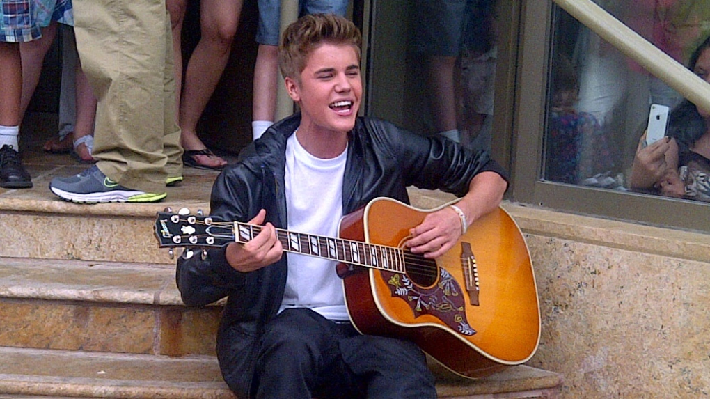 Justin Bieber plays an impromptu concert in front of Stratford's Avon Theatre