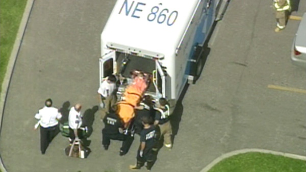 An aerial view of a child swimming pool accident victim being loaded into an ambulance on Wednesday, June 30, 2010.