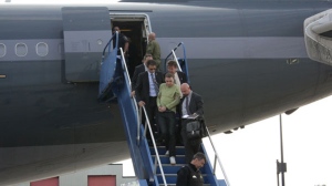 Luka Rocco Magnotta descends the stairs of an airplane flanked by Montreal police on June 18, 2012. (Montreal Police)


